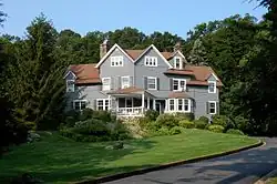 A shingled three-story house