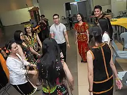 Indigenous of Sarawak and Sabah dance together during a joint Gawai-Kaamatan celebration