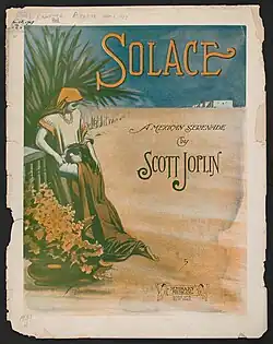 The front cover of "Solace"'s sheet music. It depicts two women on flat terrain, one apparently comforting the other, who is on her knees.