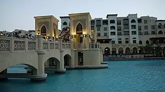 Bridge across the artificial Burj Lake connecting to the souk