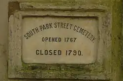 The marble plaque which reads: "South Park Street Cemetery, opened 1767, closed 1790"