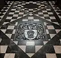 Floor of the chancel with Grosvenor arms