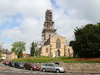Scaffolding covering the spire of the village church in Waltham on the Wolds after the earthquake