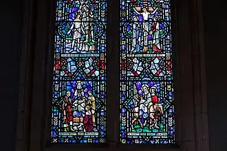 The southern Endean Memorial Window, by James Powell and Sons a.k.a. Whitefriars Glass, in the Requiem Chapel, depicting the Baptism of Jesus, Adoration of the Shepherds, Crucifixion of Jesus and Flight into Egypt, 1959.