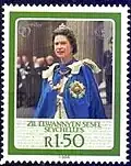 A Seychellois stamp depicting Elizabeth II in robes of the order, 1986