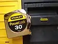 A Stanley tape measure and tool box