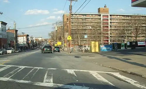 Stapleton Houses (right), looking northeast down Broad Street