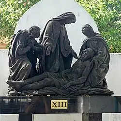 13: Jesus is taken down from the cross.