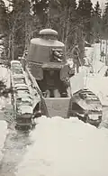 The strv fm/28 driving in a creek during winter trials