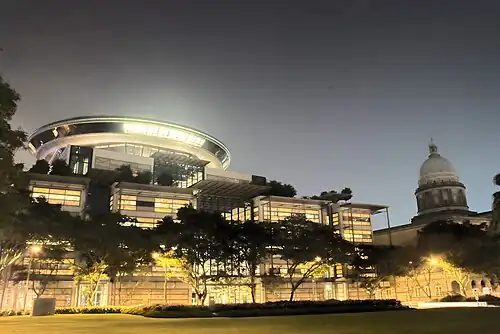 The new and old Supreme Court buildings at night