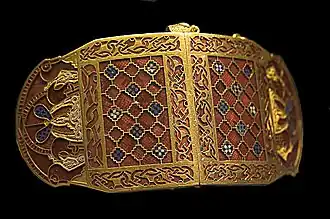 Shoulder-clasps from Sutton Hoo; early 7th century; gold, glass and garnet; length: 12.7 centimetres (5.0&nbsp;in); British Museum (London)