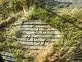 The Victorian-era reproduction of the Swastika Stone on Ilkley Moor, which sits near the original to aid visitors in interpreting the carving