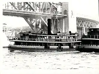 Kookooburra (centre) and another K-class ferry 4 months prior to the opening of the Sydney Harbour Bridge. Note Kookooburra's pointed stems in comparison the other K-class rounded stem.