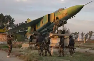 Syrian rebels at Hama Air Base during the Syrian civil war.