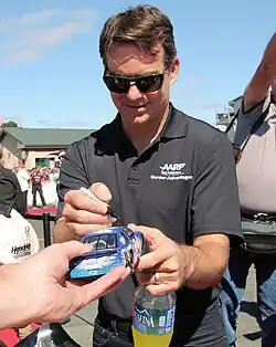 American racing driver Jeff Gordon signing autographs at Sonoma Raceway in 2015