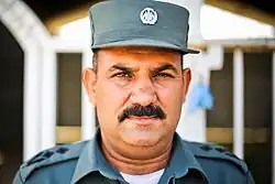 Bust-length photograph of a man in uniform.