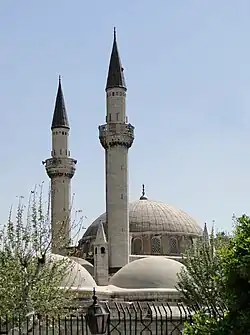 The minarets of the mosque seen from outside the fence