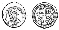 A rude coin depicting a man wearing a turban and holding a sword