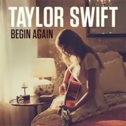Cover artwork of "Begin Again", showing Swift playing an acoustic guitar while sitting on a bed