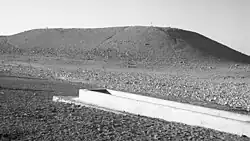 The archaeological site of Tel Malḥata in the 1950s, northeast of today's northern runway of Nevatim Airbase, animal drinking trough in the front