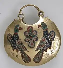 Front of a temple pendant with two birds flanking a tree of life; 11th–12th century; cloisonné enamel and gold; overall: 5.4 by 4.8 by 1.5 centimetres (2.13&nbsp;in ×&nbsp;1.89&nbsp;in ×&nbsp;0.59&nbsp;in); made in Kyiv (Ukraine); Metropolitan Museum of Art (New York City)