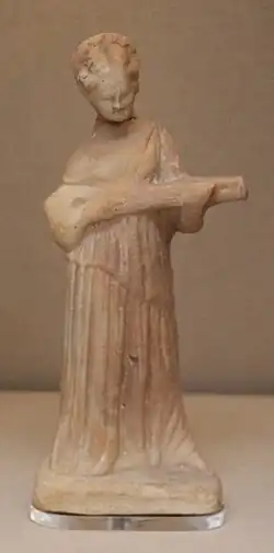 Terracotta figure of a woman playing a pandoura, ca. 300 BC, Cyprus (British Museum)