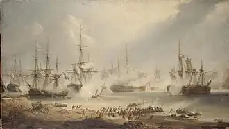 Seven ships lie in various states of repair on still waters. On the shore, in the foreground, large crowds rush towards the sea. Smoke drifts through the scene.