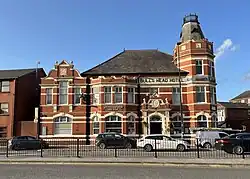 A large historic pub building in Walkden called the Bull’s Head Hotel.