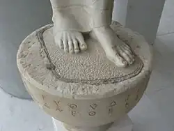 Base with inscription.