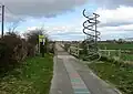 Double helix sculpture where National Cycle Route 11 meets track along Hobson's Brook to Nine Wells