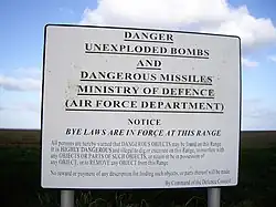 A warning sign posted "By Command of the Defence Council".