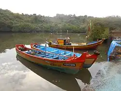 Big fishing boats tied to the old stone anchors