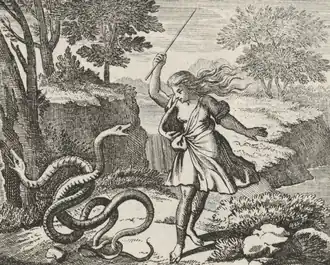 A person with flowing robes holding a staff strikes two intertwined snakes on the ground