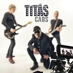 A dark sphere surrounded by a corona-like light and a particular glow close to the upper right corner. The names of the band and of the album can be seen around it