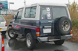 Middle-spec fibreglass-top 3.4 LX (BJ73V; pre-facelift, Japan, rear)