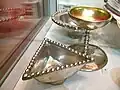 Traprain Law Treasure. Triangular silver dish, drinking cup and bowl.