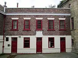 Former almshouses on the west of the court yard (rebuilt 1787)