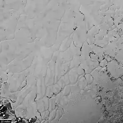 Close-up photograph (context) showing polygonal convection cells in the nitrogen ice of Sputnik Planitia, the western lobe of Tombaugh Regio (14&nbsp;July 2015).