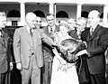 President Harry Truman accepting a turkey (this one a Bronze) from the turkey industry, 1949