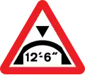 Warning of maximum headroom of arch bridge directly ahead (imperial)