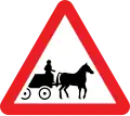 Horse-drawn vehicles likely to be in the road