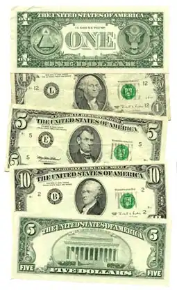 Front and back of several US bank notes including $1, $5 and $10 bills