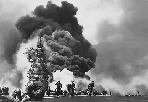 American aircraft carrier USS&nbsp;Bunker Hill burns after being hit by two kamikaze planes within 30 seconds.