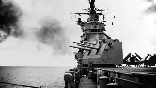 Valley Forge firing her forward 5-inch guns, in November 1949