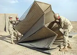 United States Navy Seabees assembling HESCO MIL units