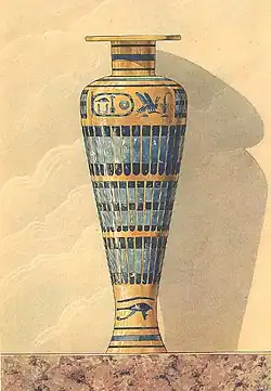 5th Dynasty wooden funerary vase, gilded, with faience inlays