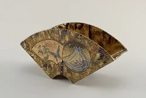 Faience or earthenware vase with two feet, with mountain night scene on the back and a floral daylight scene with butterfly on the front. (1884–1885)