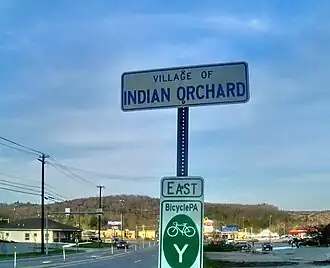 Signage on U.S. Route 6 eastbound entering the village of Indian Orchard.