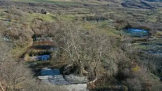 A sign towards Tnjri, a 2000-year old plane-tree near Skhtorashen