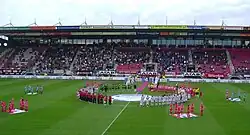 Women's soccer players from FC Twente & SC Heerenveen in a circle on the soccer field in Enscede for the opening ceremony before the first Women's Eredivisie game on 29 August 2007